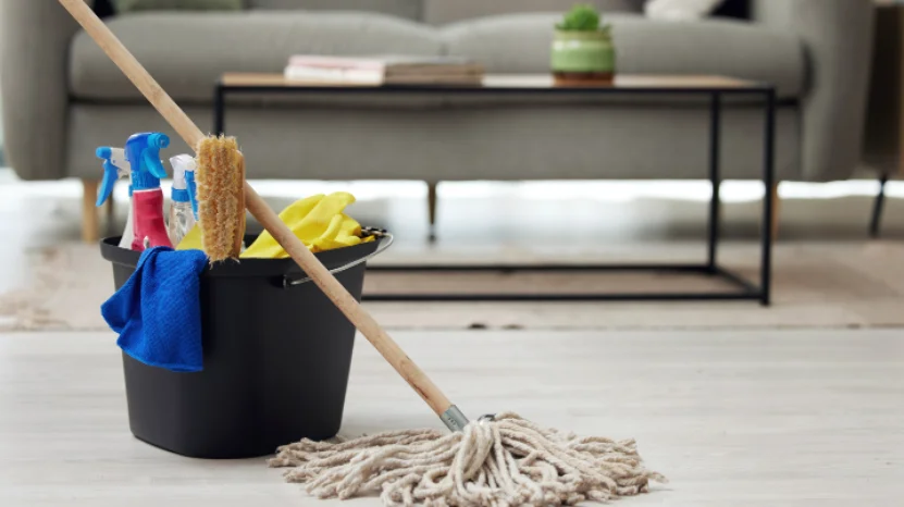 Person cleaning a modern kitchen before property viewings
