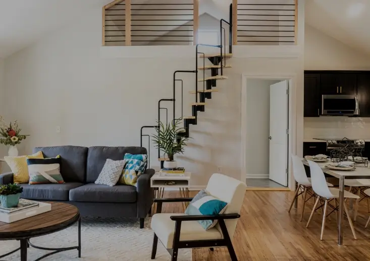 Bright and tidy living room interior with sofa and natural light